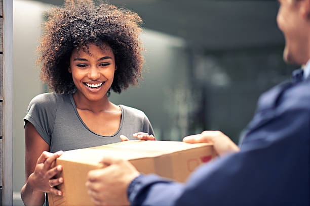 Courier handing a package directly to a customer